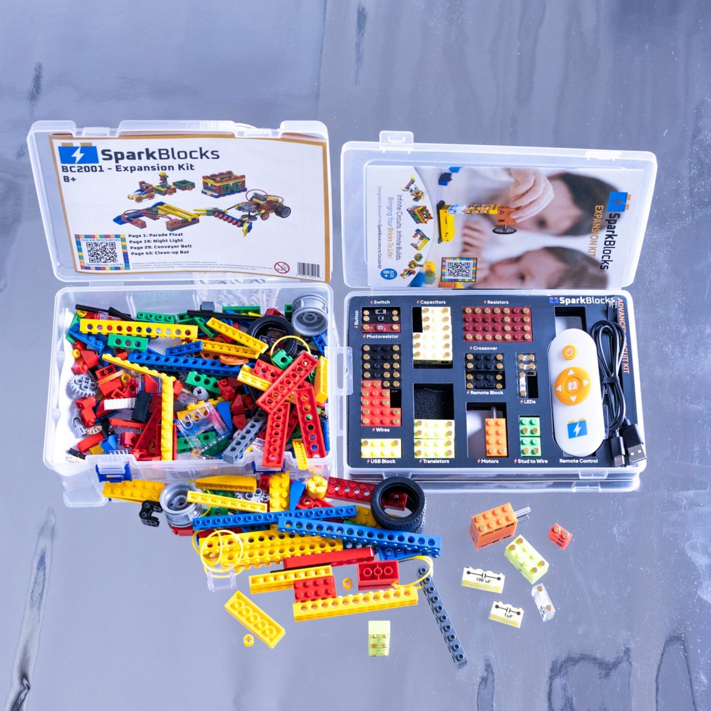 SparkBlocks Expansion Kit comes in two cases: one for plastic bricks, the other for functional electronic blocks, displayed on a metallic background