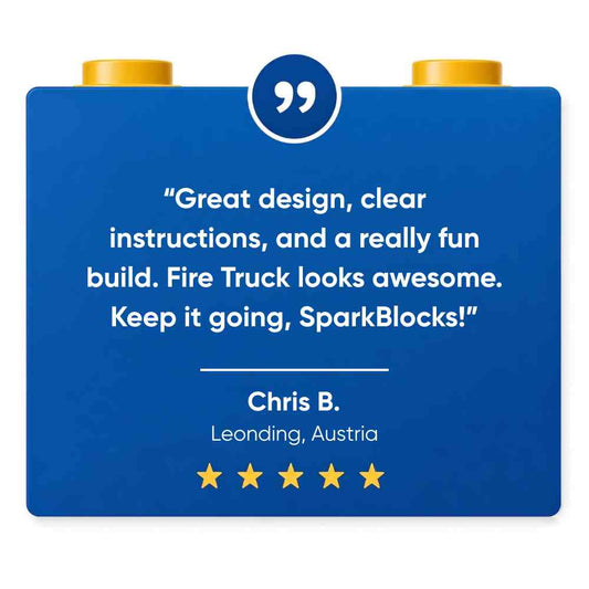 A 5 star review for SparkBlocks, written on a blue block with text and gold studs on a white background.
