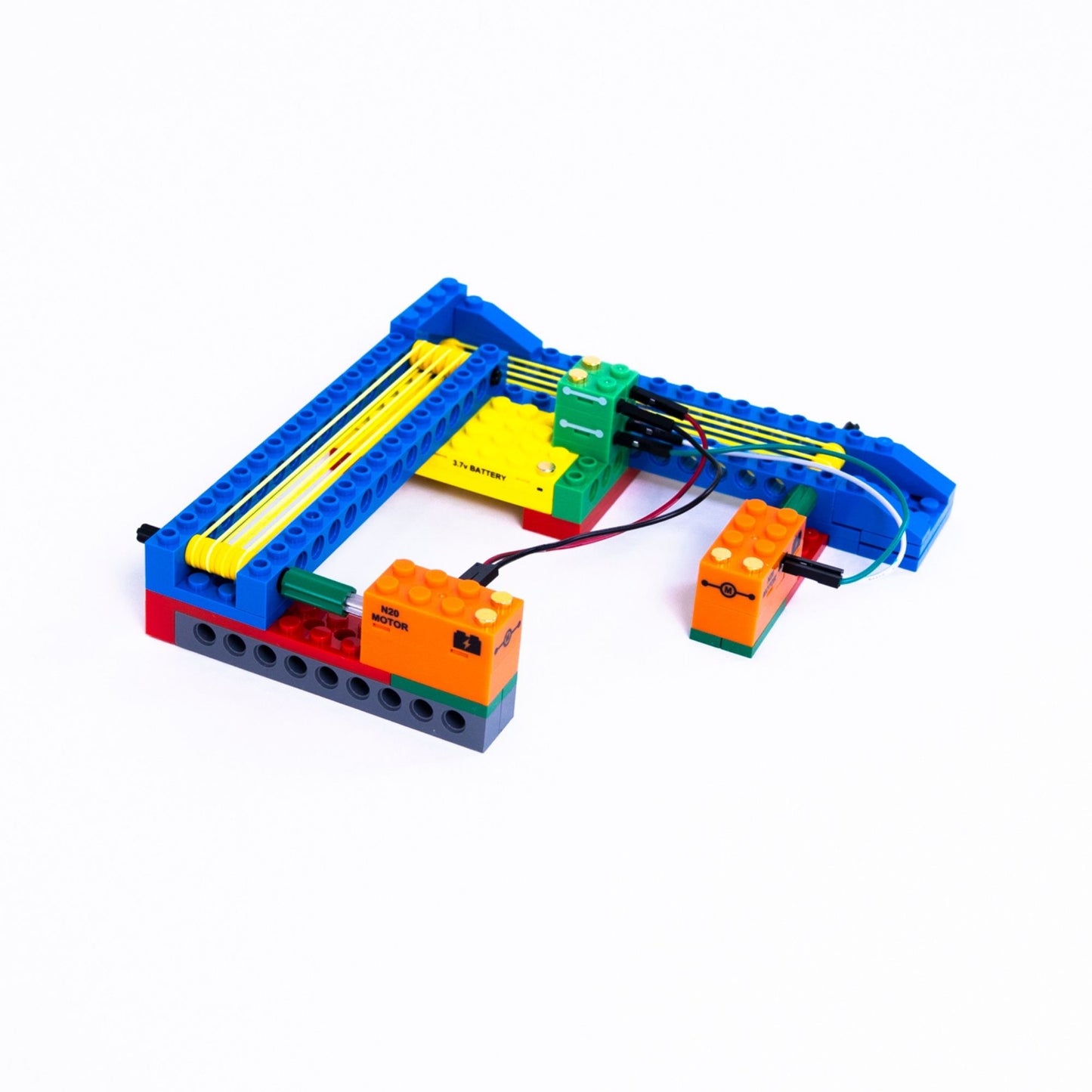Colorful toy robot or electronic device made of interlocking bricks on a white background