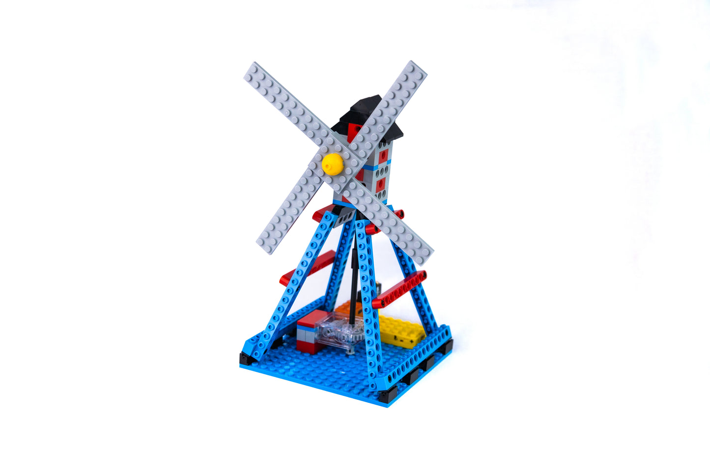 Toy windmill made of interlocking bricks on a white background