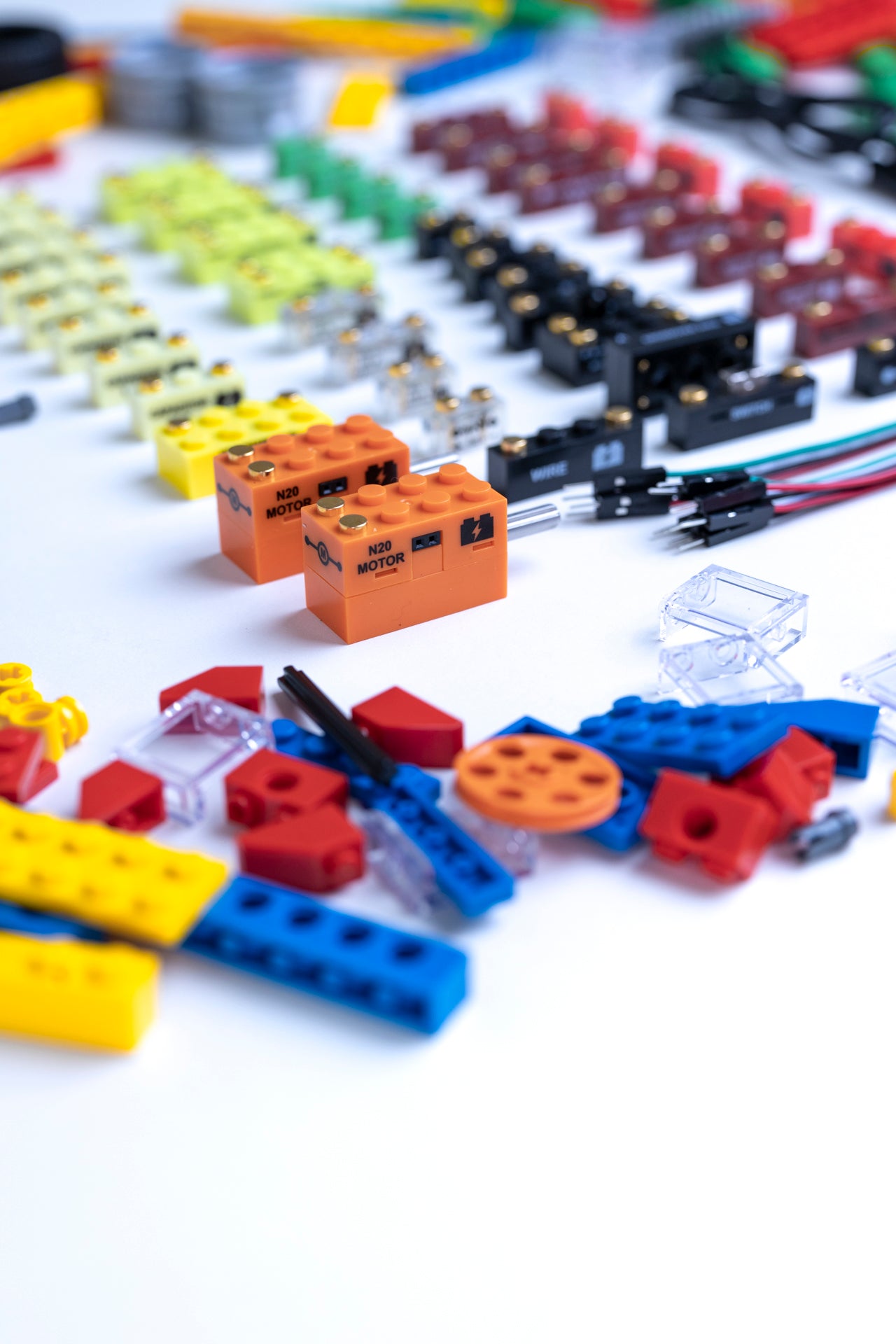 Colorful, LEGO-compatible functional electronic circuit building blocks on a white surface
