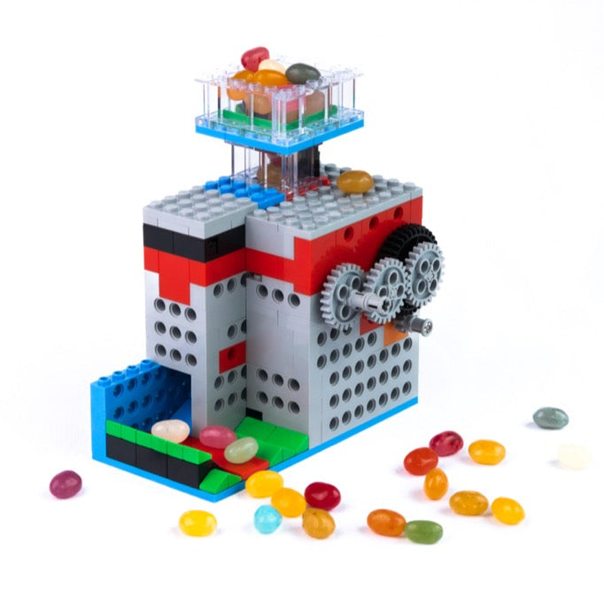 A functional candy dispenser built with the 3-in-1 Mighty Machines Kit, featuring gear-driven interlocking bricks that dispense jelly beans for a hands-on learning toy experience.