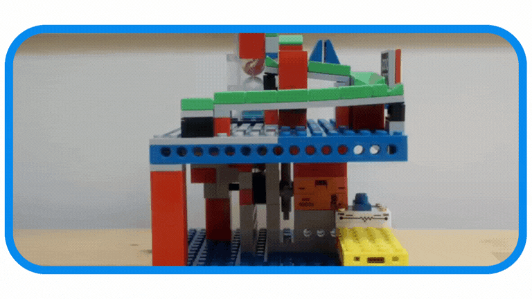 A functional marble lifter mechanism built with interlocking bricks from the 3-in-1 Mighty Machines Kit, demonstrating a motorized STEM toy and hands-on learning toy.